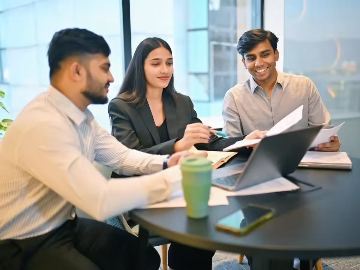 Indian professionals collaborating in a modern boardroom